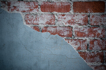 old brick wall with fallen plaster