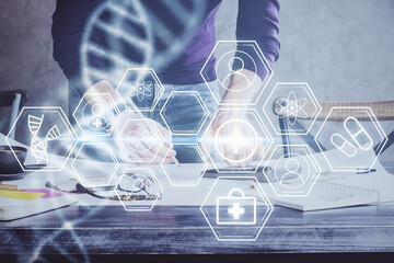 Man's hands working with notes background. Genetic engineering and gene manipulation concept.