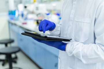 Picture of hand scientists using tablet a search data in lab , Concept science and technology,...