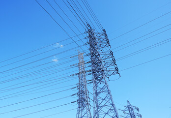 Power transmission tower, electricity tower, electricity wire,
Blue sky background,...