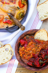 Sweet peppers in tomato and sour cream sauce, a traditional dish in some European countries. Rustic style.