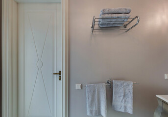 Towels and door in Modern bathroom in luxury apartment