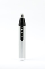 Electric silver hair trimmer on a white background.