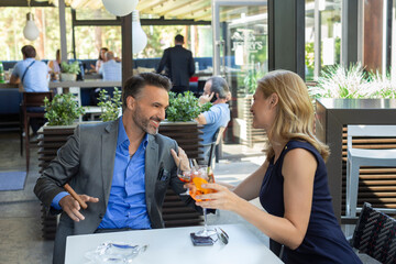 Business couple flirting in the cafe bar