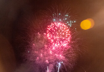 Fireworks against the dark sky. Celebrating New Year or Independence Day