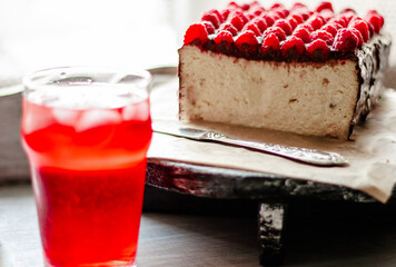 Raspberries in chocolate on a cheesecak. Homemade food. Retro.