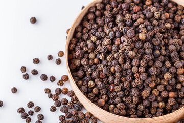 fragrant black pepper on white acrylic background