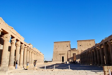 Tourists at the courtyard of the Philae Temple. Philae Temple pavilion, Agilkia Island in the Nile...