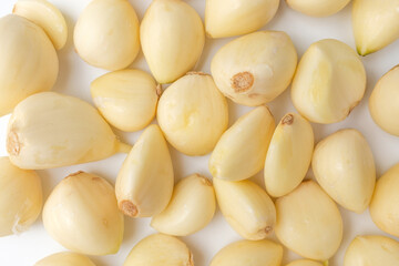 Manicured garlic on white background