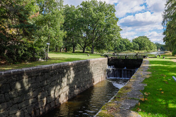 Fototapeta na wymiar Hjalrmare Canal, Sweden The Saby lock on the 13 kilometres long canal that connects Lake Hjalmaren with Lake Malaren in Sweden built 1639.