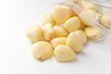 Manicured garlic on white background