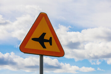 A n airplane street sign near a small airport.