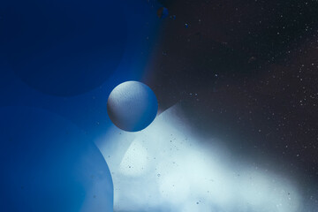 minimal blue background, orb suspended in space