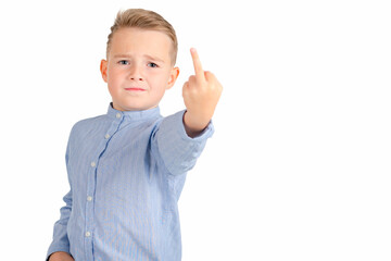 Calm school boy shows rude gesture on a white background