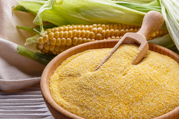 Polenta corn porridge on white wooden rustic background
