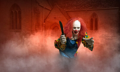 clown with a knife in hand in front of a scary scene