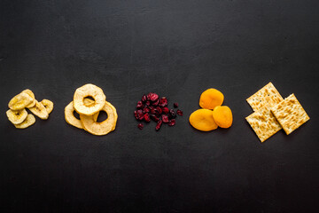 Flat lay of appetizers and snacks overhead. Nuts and dried fruits with crackers