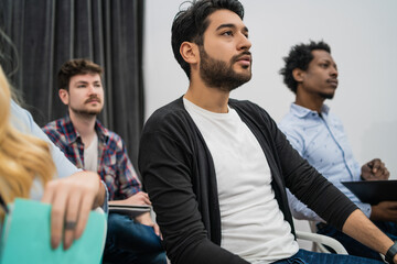 Creative business people listening to colleague.