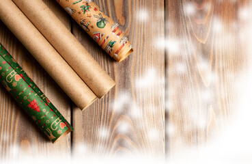 rolls of wrapping paper on the wood table
