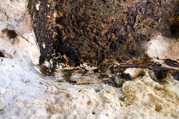 Rock cave ceiling with black formations