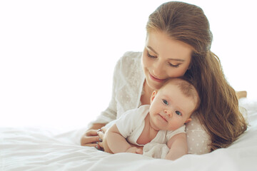 Small child with a woman. Baby with mom. High quality photo.