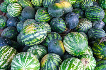 Sweet watermelons in big basket from above on rural market