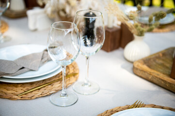 Wine glasses. Festive table setting. Empty glasses are on the table.