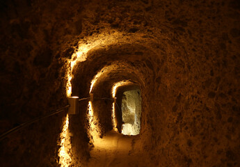 Light at the End of the Tunnel inside the Medieval Cave City of Vardzia on Erusheti Mountain Near...