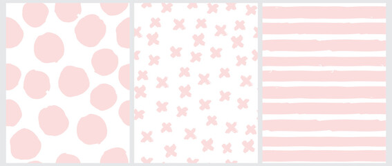 Cute Pastel Color Geometric Seamless Vector Patterns. Pink Hand Drawn Polka Dots, Crosses and Vertical Stripes on a White Background. Lovely Infantile Irregular Doodle Print. 