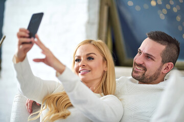 Couple takes a selfie at christmas