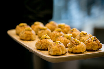 dinner pastry on wooden tray for buffet