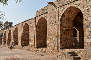 A mesmerizing view of architecture of small tomb at old fort from side lawn.