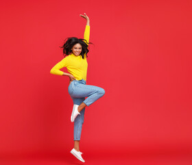 Happy ethnic woman smiling and jumping.