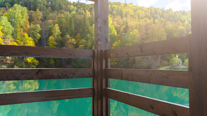 Blue mountain lake with a house. Beautiful autumn morning