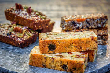 Healthy seeded protein bars with nuts are arranged on display