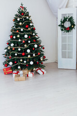 Classic New Year Tree decorated in grunge room interior