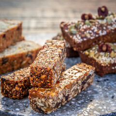 Healthy seeded protein bars with nuts are arranged on display