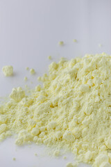 purified sulfur powder on a white acrylic background