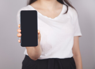 Woman using smartphone. The concept of using the phone is essential in everyday life.