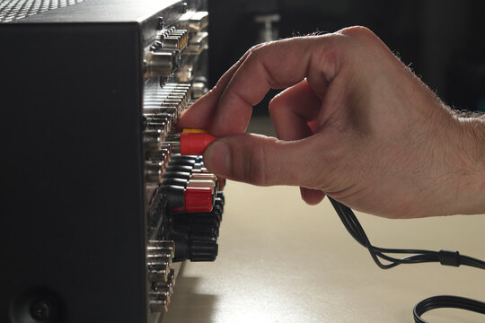 Technician Connects The Audio Cables To The Rack