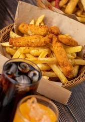 Spicy Chicken Fingers and French Fries with ice cola.