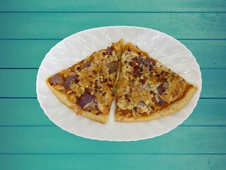 Veg Pizza with toppings of onion capscicum corn cheese cottage ready to serve