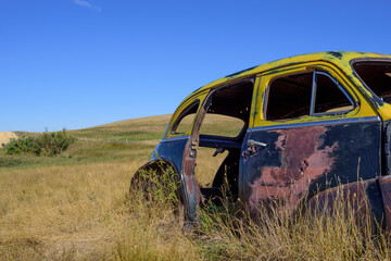 abandoned old car in the field