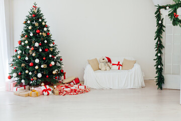 Decorated room with beautiful Christmas tree and gifts
