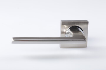 Silver metal door handle on a white background.