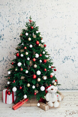 Decorated room with beautiful Christmas tree and gifts