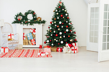 Christmas and New Year decorated interior room. Holiday decorated room with bed on window sill. Festive Xmas