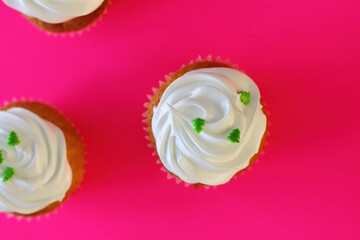 Cupcake decorated by cream meringue and sweet Christmas tree, dessert for party, birthday, new year eve, festive