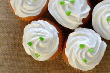 Cupcake decorated by cream meringue and sweet Christmas tree, dessert for party, birthday, new year eve, festive