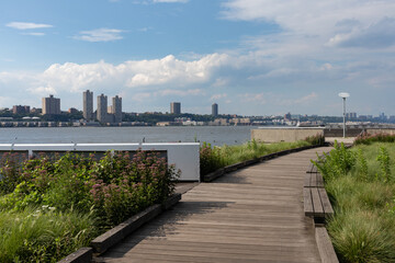 Fototapeta na wymiar Empty Walkway at Riverside Park South along the Hudson River in Lincoln Square New York during Summer 